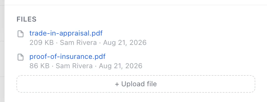 The Files part of a contact record, listing two documents and the upload button
